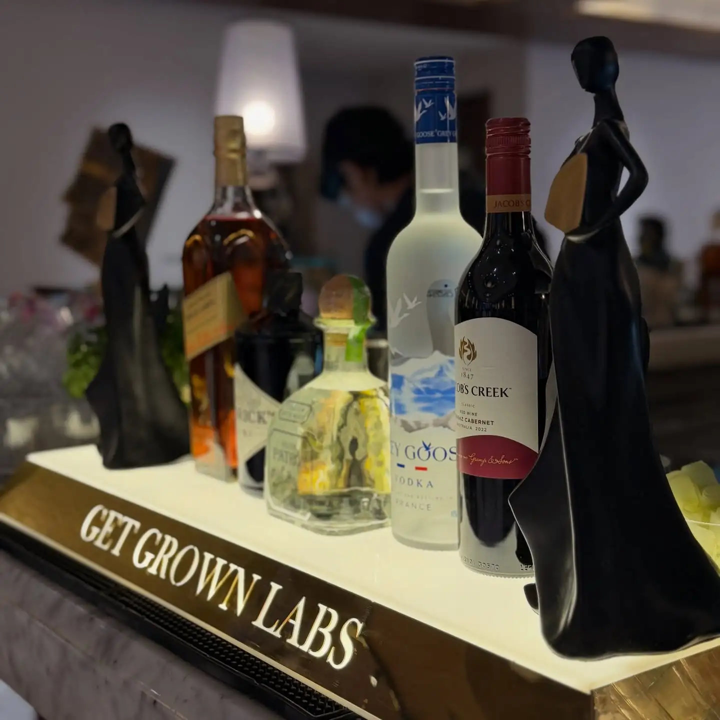 Signature cocktail plated with laboratory-inspired garnish and rising vapor